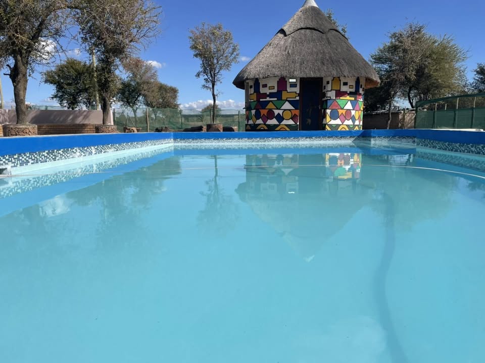 Pool and rondavel at The Farm